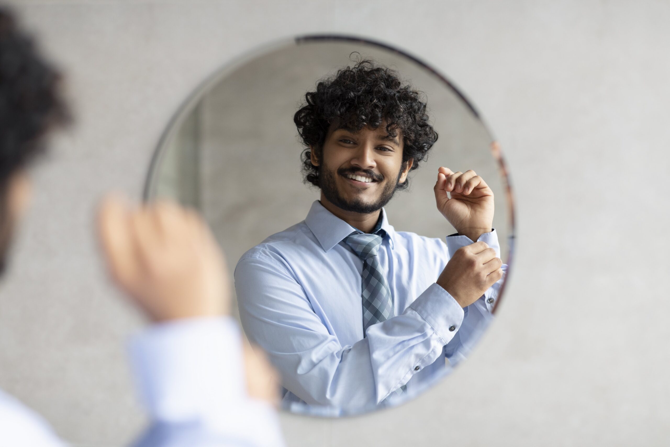 happy-bearded-indian-businessman-standing-in-bathr-2025-03-18-17-28-39-utc-min